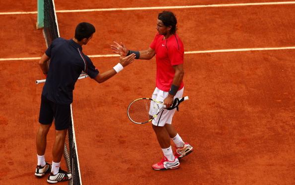 Novak Djokovic shaking hands with Rafael Nadal at the French Open